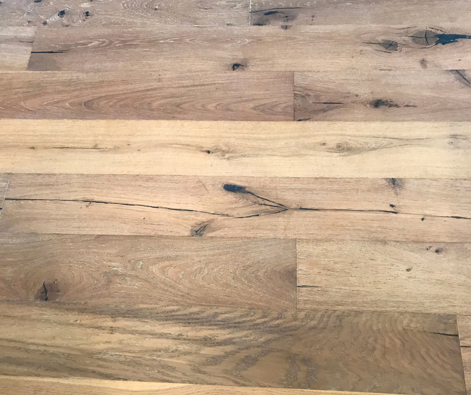 A closeup of pine engineered wood flooring