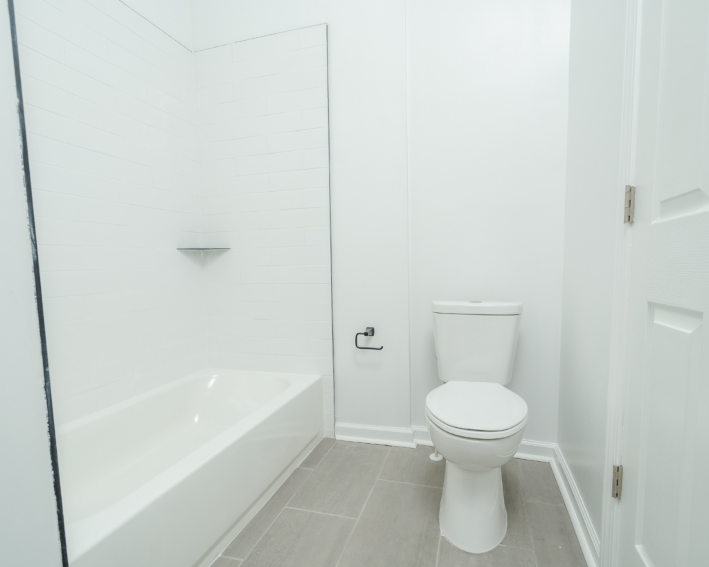 A simple all-white remodeled bathroom in frederick md